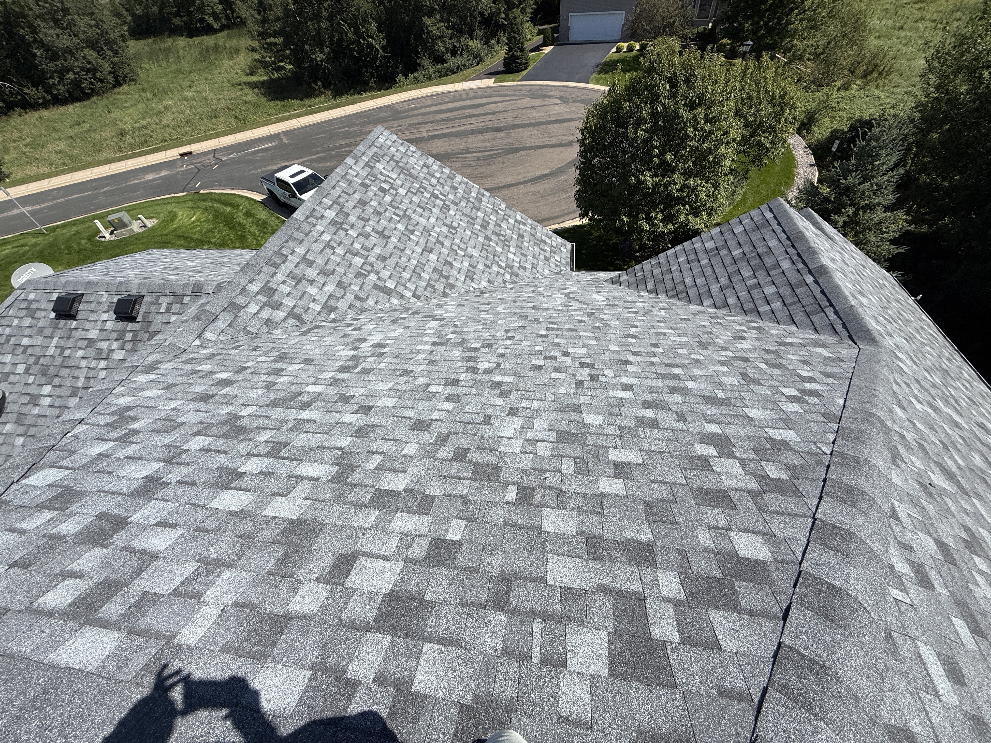 Drone view of a finished gray shingle roof